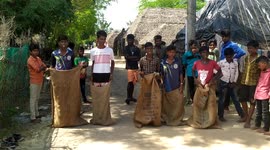 Kids in South India enjoy playing Potato sack race on the eve of Pongal (Harvest)Festival in South India