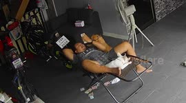 Chair breaks as owner holds his two pet French bullies