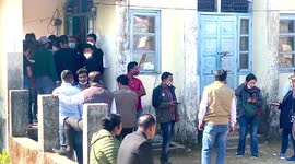 People wait in line to show a mandatory Covid-19 certificate in Pasighat