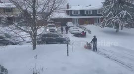 Daredevil performs a snowmobile drive-by in a residential street in Ottawa during blizzard