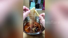 Chinese man uses chopsticks to skilfully knit noodles