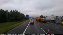 Truck crashed on M40, Oxfordshire, England. Slogan on the side says 
