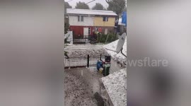 Ice river flows through street during hail storm in Chile