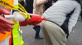 Man in Squid Game costume offers 