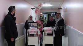 Relatives of Palestinian prisoners Yousry Al-Jolani, celebrate of his twins daughters who were born through sperm that were smuggled out of an Israeli jails