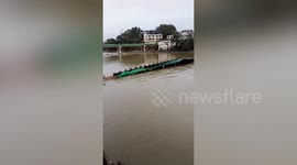 Pontoon bridge in southern China capsizes plunging locals into river
