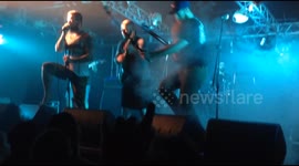 Guitarist falls over while trying to return selfie stick