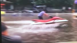 Man drives jet ski in Shanghai flood