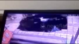 Four people fall into hole as it opens up in pavement