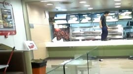 Upset man smashes KFC