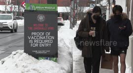 Mandatory vaccination policy signs go up at restaurants in Markham near Toronto Canada as Ontario government prepares to slightly lift lockdown restrictions at the end of January