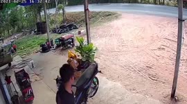 Motorcycle rider falls into ditch while doing wheelie