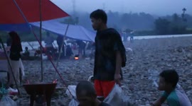 hundred of people hunt fish in forbiden pond on  lumasang river