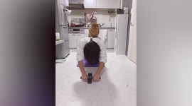 'Workout instructor' tabby cat jumps onto man's back while he exercises in Japan
