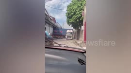 Skilful driver successfully moves out of parking space into narrow road