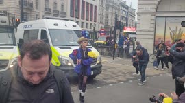 Fashion derringer Pierre Garroudi organised a photo shoot amidst the NHS protest march at Piccadilly Circus 22-01-22
