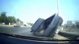 Pick-up truck flips over after trying to overtake on highway in Thailand