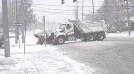 Large snow plow truck seen in Norwalk, Connecticut during winter blizzard