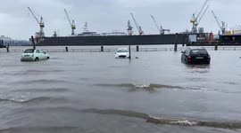 Parked cars left partially submerged by floodwater as Storm Malik hit Hamburg