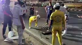 Volunteers recover a pregnant woman's phone dropped in a sewer