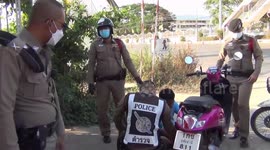 Wild snake caught after slithering into motorcycle parked outside school in Thailand
