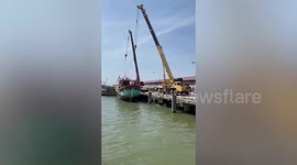 Crane falls into the SEA when cable snaps while lifting ship