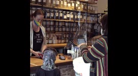 Salina and her children clean up along a busy road.