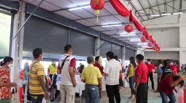 Vaccine medics wear red-and-gold robes to mark Chinese News Year in Thailand