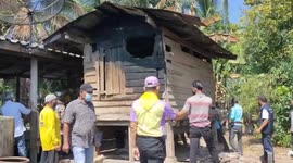 Kind locals help their neighbour move by carrying his fire-damaged barn to the next village