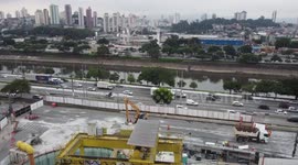 Aerial footage of crater concrete to block part of Marginal Tietê due to flooding in Sao Paulo, Brazil