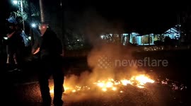 Police in Indonesia attacked by mob as they break up barricades