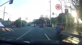 Motorcycle rider clipped by another two-wheeler crashes to the ground before hitting another person