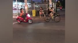 Unleashed pet husky crosses road while her owner guides her