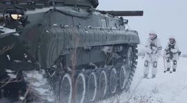 Russian soldiers ski behind advancing tanks in Siberian combat drills