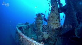 Divers work to remove ghost nets from WWII shipwreck that pose danger to marine life