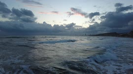 Supboarding at sea during a storm. Evening, clouds and storm.