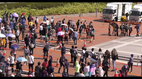 Huge testing queues in Hong Kong after record spike in daily infections