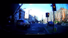 London cyclist runs through red traffic light