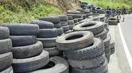 Residents donate thousands used car tires to be installed at scene bus accident that killed 13 passengers in Indonesia