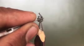 Artist carves miniature radio out of pencil tip
