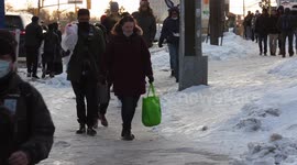 University students slip slide and fall on dangerous slippery icy sidewalk near campus in Waterloo Ontario Canada as winter snow and ice takes it's toll on the backsides of pedestrians