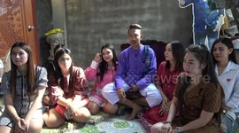 Thai tattoo artists lives with SEVEN wives who take it in turns to sleep with him