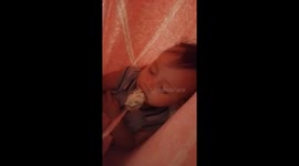 My daughter is chewing food even if she's sleeping on the baby swing, I can't believe it!