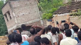 Locals cheers as erosion causes home to collapse into Ganges