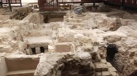 Palestinians work at the archaeological site of Hilarion Monastery or Tell Umm al-Amer
