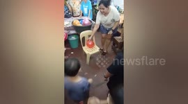 Chubby boy breaks plastic chair while playing balloon popping game at kids' party