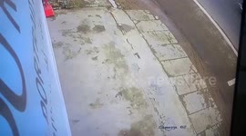 Motorcycle rider crashes into phone shop and SOMERSAULTS over counter into saleswoman