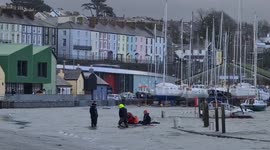 Couple in Wales dragged ashore on inflatable as Storm Eunice tidal surge traps parked cars
