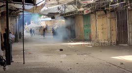 Palestinian protesters clash with Israeli security forces following a demonstration
