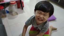 4-year-old boy falling down on floor while standing watching TV